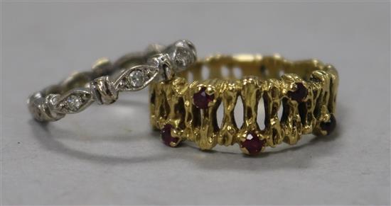 A contemporary gold and ruby set ring and a white gold and stone set eternity ring,